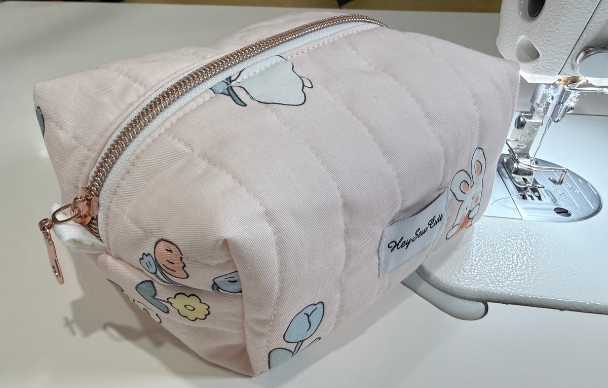 Blush Bunny rose-gold-tone zip and fabric tab detail