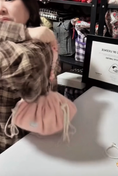 Load image into Gallery viewer, Strawberry Mochi Bag held after closing to demonstrate its portable pouch shape
