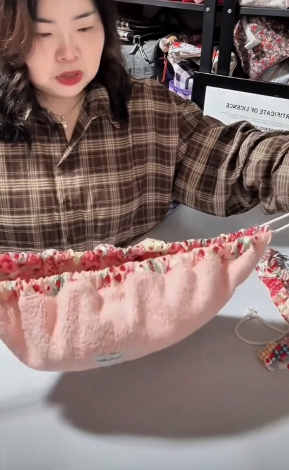 Strawberry Mochi Bag lifted from its flat open shape as the drawstring closes